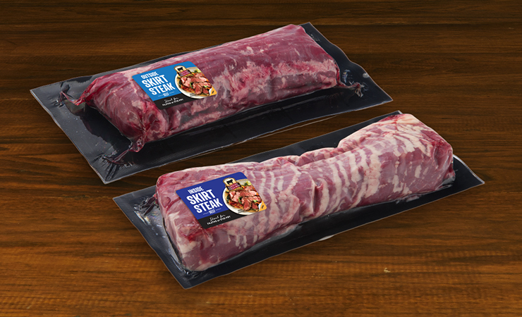 National Beef box with three vacuum-packed Certified Angus Beef primals displayed in front on a wooden surface