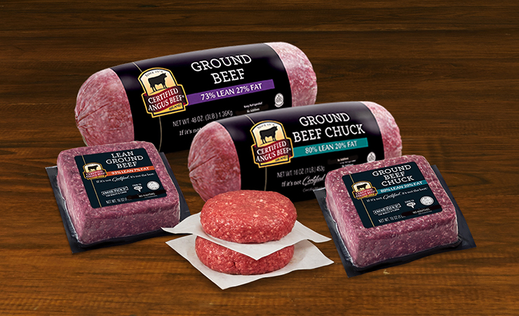 Assorted Certified Angus Beef ground beef products including ground beef chubs, square brick packs, and burger patties arranged on a wooden surface
