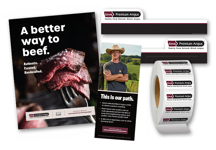 Iowa Premium Angus point-of-sale materials including beef posters, a rancher banner, and a roll of branded meat case labels