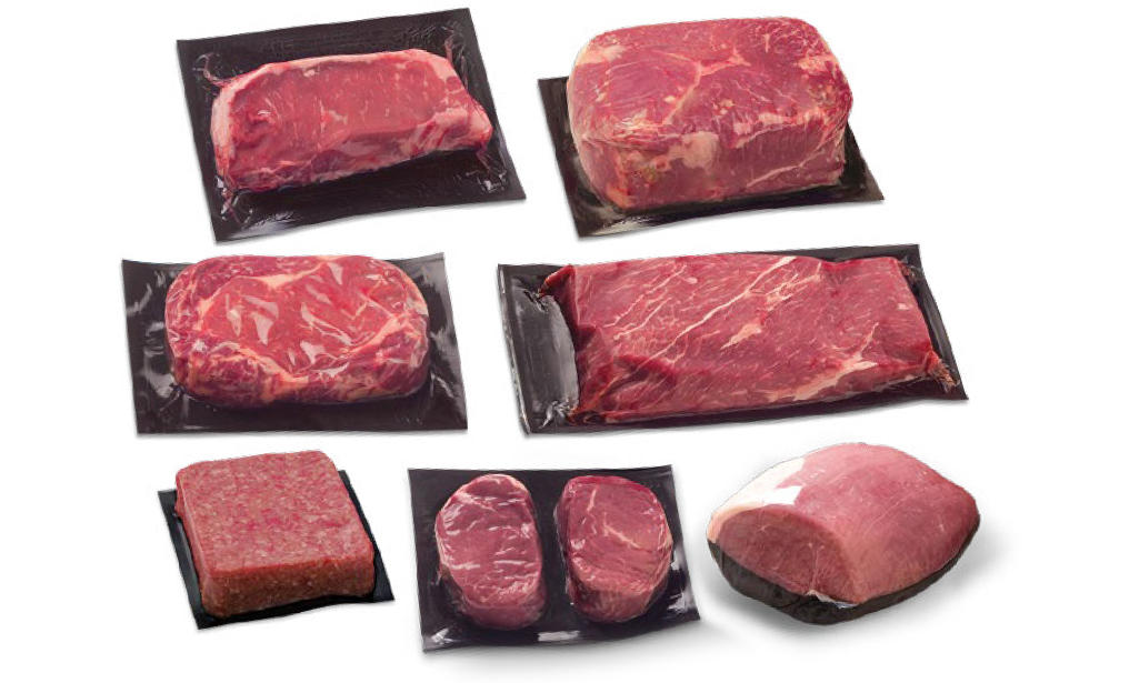 Assortment of vacuum-sealed beef cuts on branded packaging film.