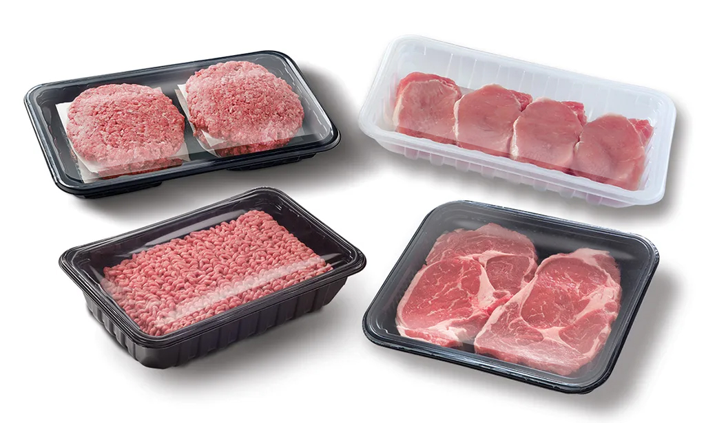 Assorted packaged meat cuts including steaks, ground beef, and pork chops in lidded trays.