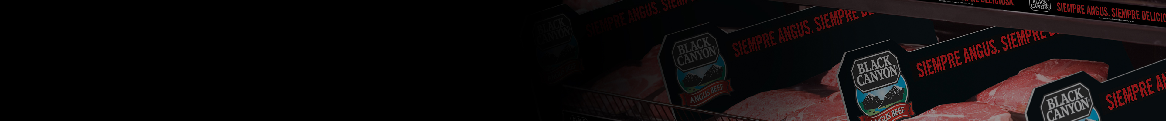 Shelves of packaged Black Canyon Angus Beef with bilingual rail strips reading always angus always delicious and siempre angus siempre deliciosa