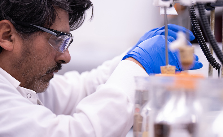 Lab technician conducting research with scientific equipment.