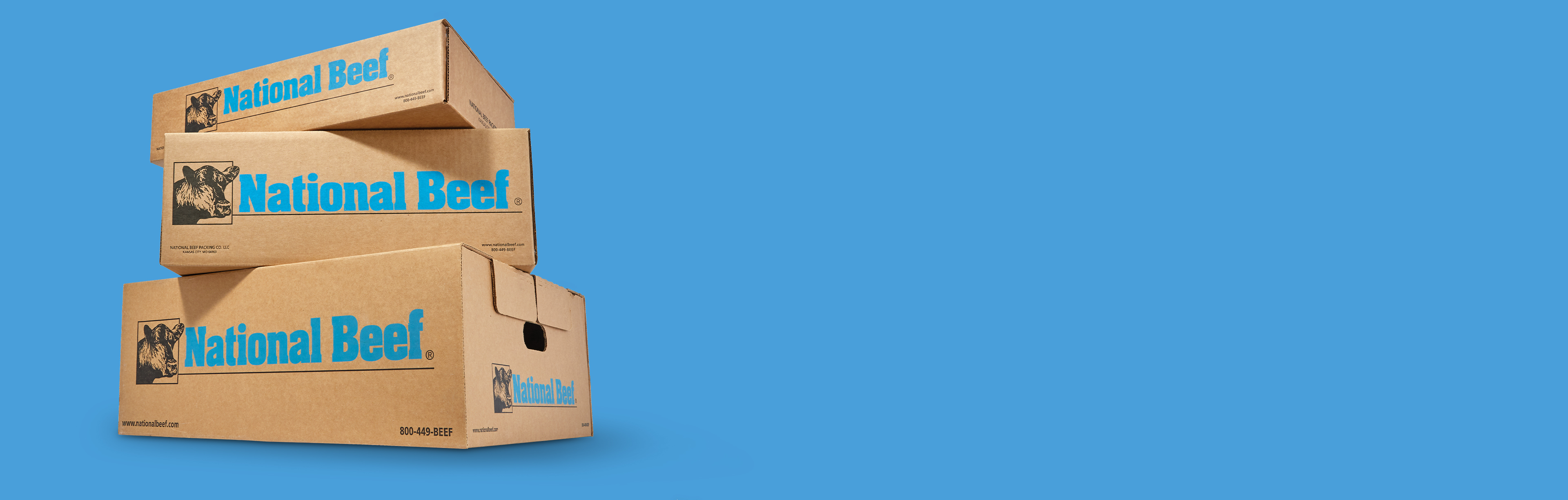 Stacked National Beef boxes against a blue background.