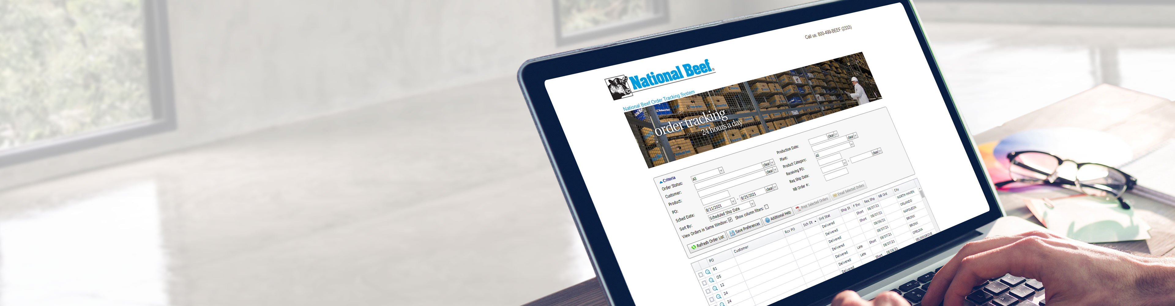 Person using a laptop displaying National Beef’s order tracking system