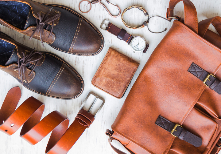 Leather accessories including shoes, a belt, a bag, a wallet, a watch, a keychain, and a bracelet.
