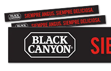 Black Canyon bilingual rail strip with logo and Spanish slogan on black background