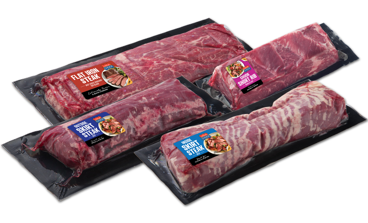A grouping of Retail Ready Specialty cuts: Flat Iron Steak, Skirt Steak, Chuck Short Rib, and Inside Skirt Steak in VSP packaging.