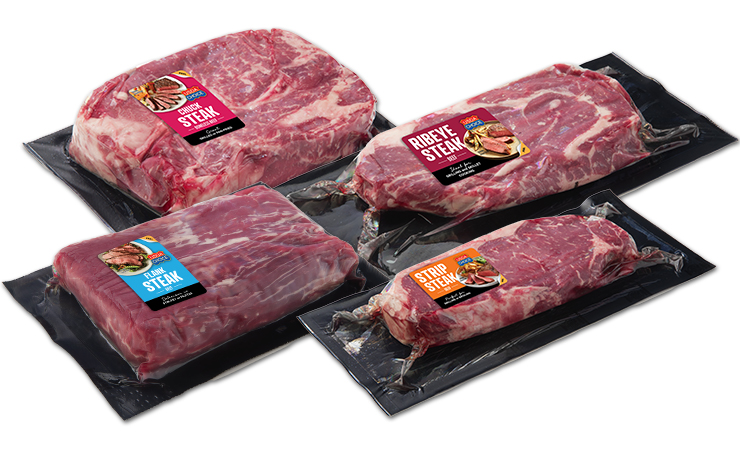 A grouping of Retail Ready Chuck Steak, Ribeye Steak, Flank Steak, and Strip Steak in VSP packaging.