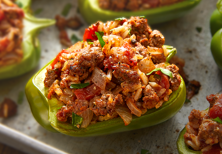 Stuffed green bell pepper filled with seasoned ground beef and vegetables.