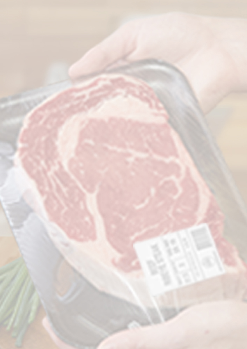 Person holding a packaged steak.