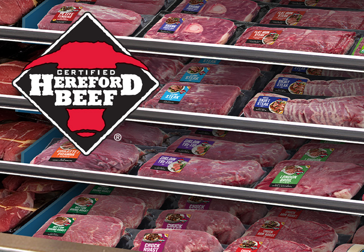 A meat case with multiple vacuum-sealed steaks and the Certified Hereford Beef logo imposed on the upper left corner.